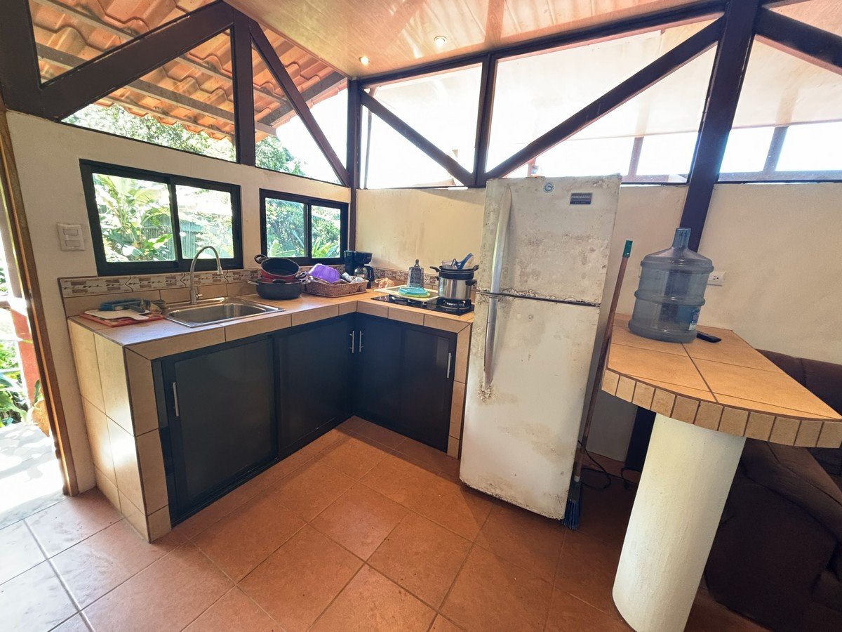 0.16 Acres – 4 Living Units, 7 Bedroom Riverfront Investment Package Near Dominical Beach With Owner Financing!!!