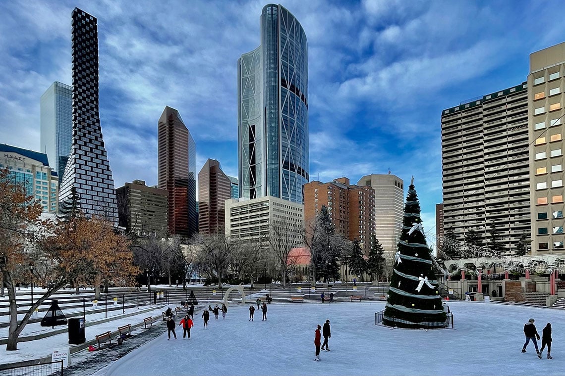 Winter at Olympic Plaza in downtown Calgary featuring public ice skating, skyline views, and city landmarks. Explore inner-city Calgary lifestyle and real estate insights.
