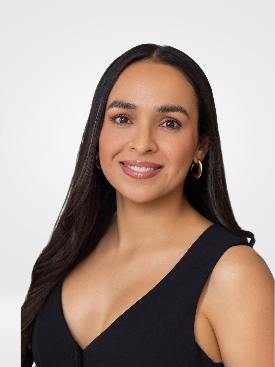 Melissa Resendiz-Perez, smiling in a black sleeveless top.