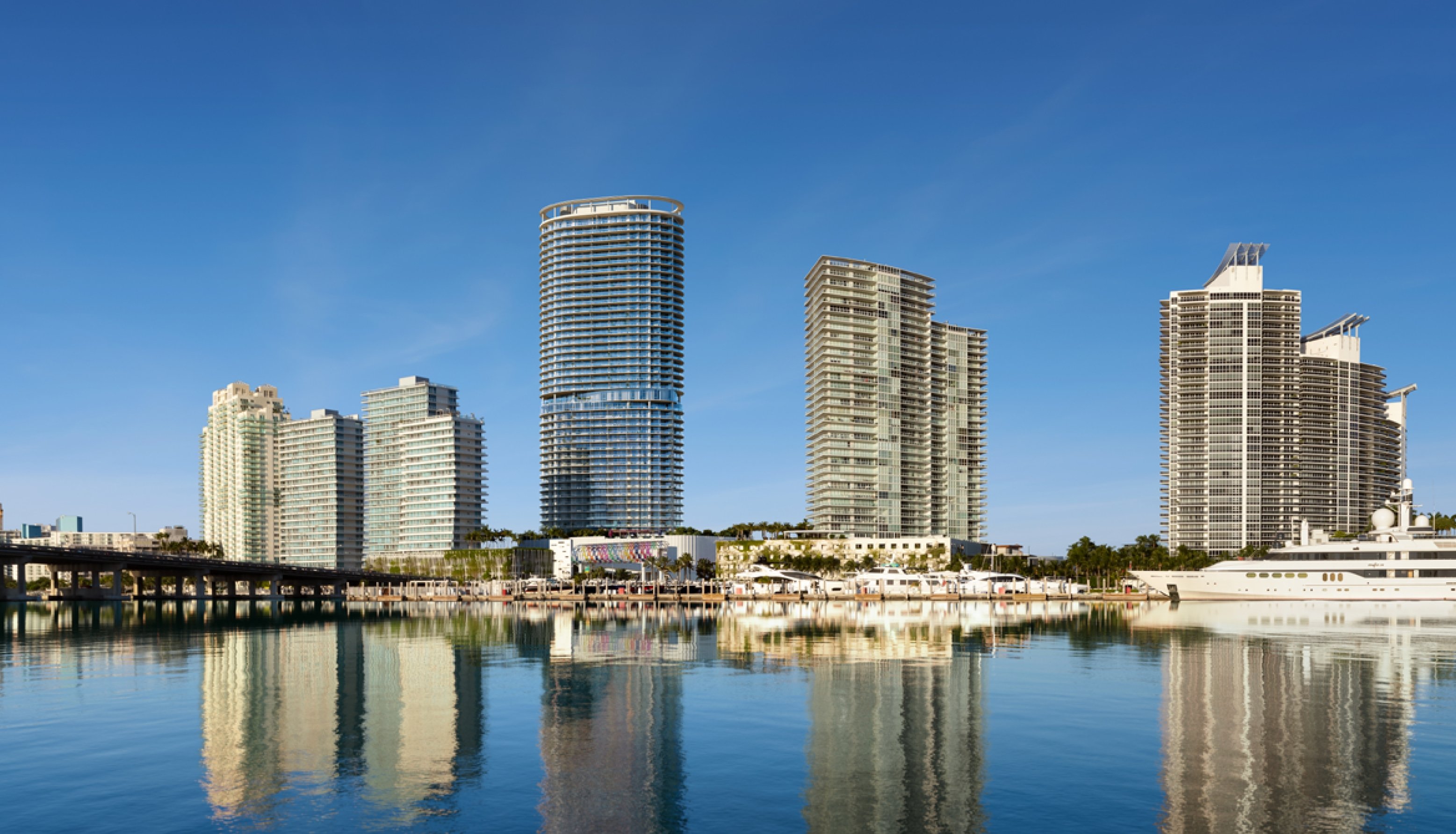 Rendering of Five Park Miami Beach and neighboring towers rising above the Miami Beach Marina