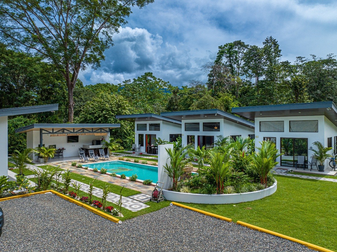 Incredible turnkey investment opportunity, 3 Rental villas, and a 2 Bedroom Home with a large pool.