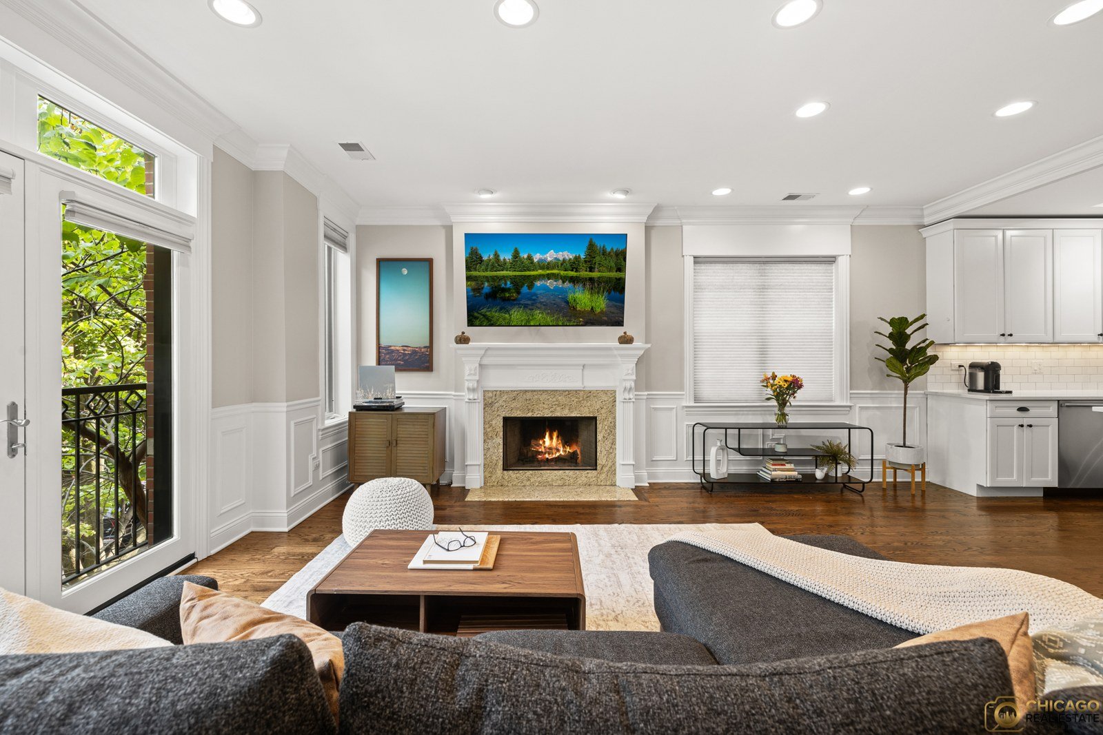 Staged living room with a fireplace at 3822 N. Damen Ave., a North Center condo listed by Dee Savic