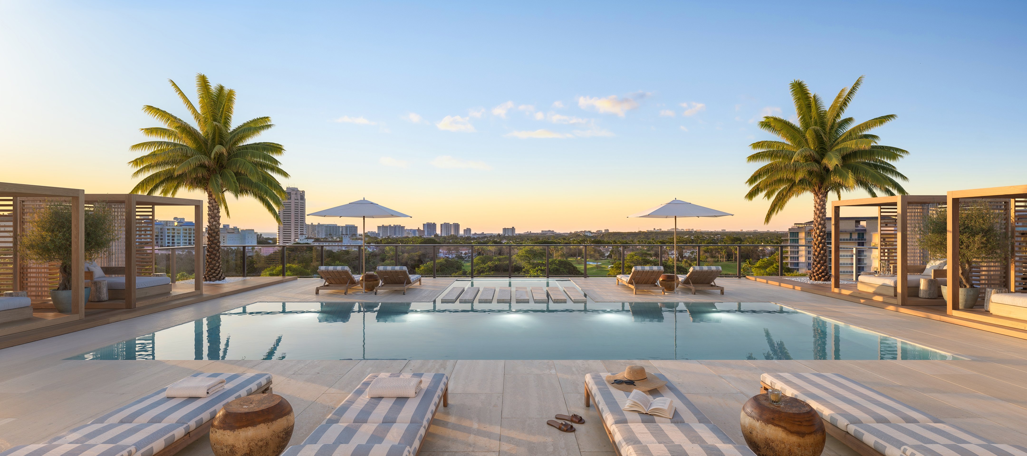 Rendering of the Glass House Boca Raton rooftop pool with loungers and city views