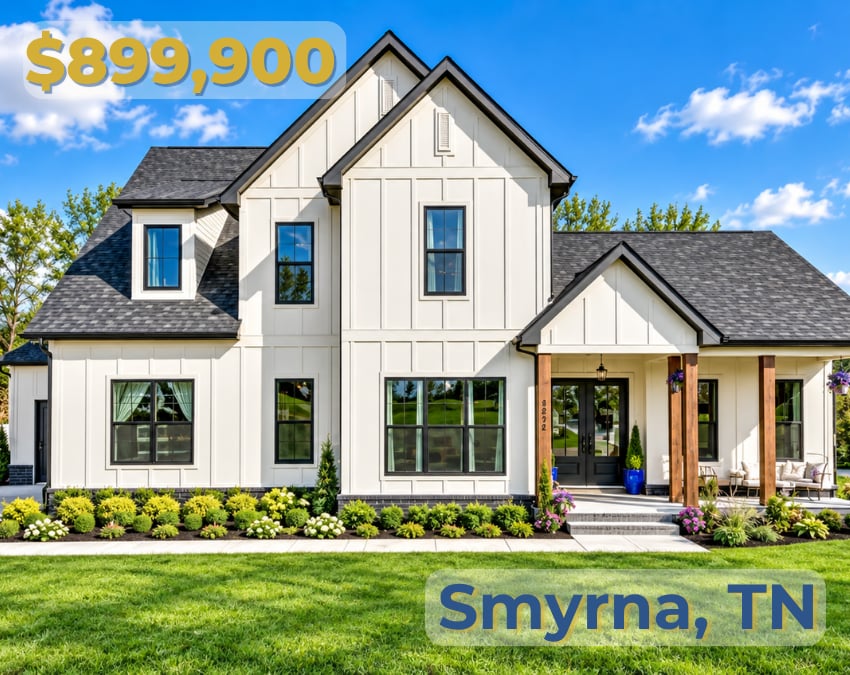 White two-story Smyrna home with a covered porch, dark roof, and landscaped front lawn.