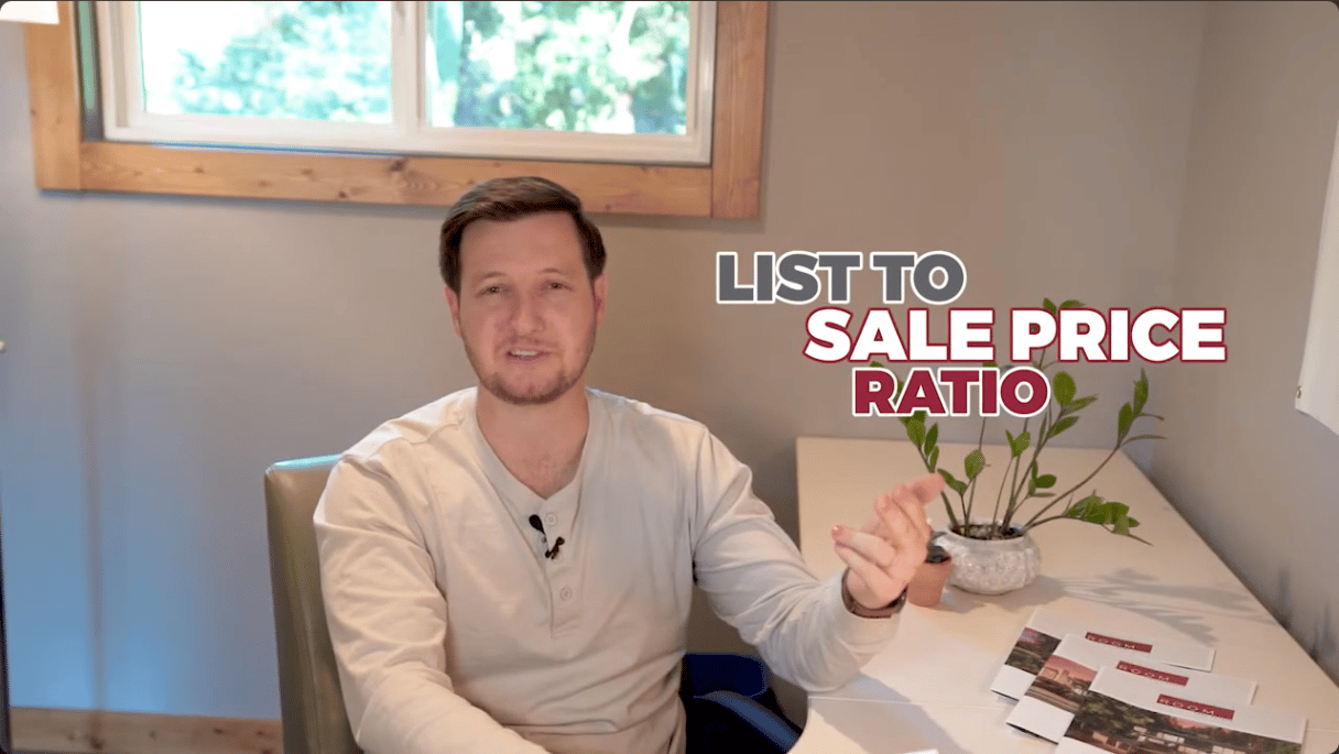 Man explaining the list-to-sale-price ratio at a desk.