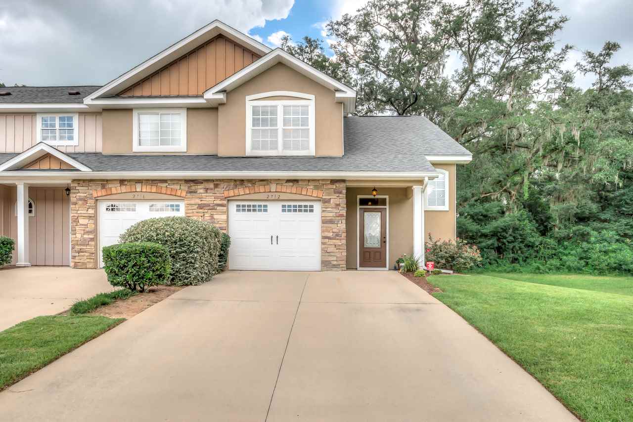 A charming home situated in the vibrant center of the community, showcasing its welcoming atmosphere and local character.