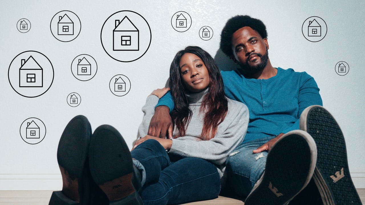 A couple sitting on the floor