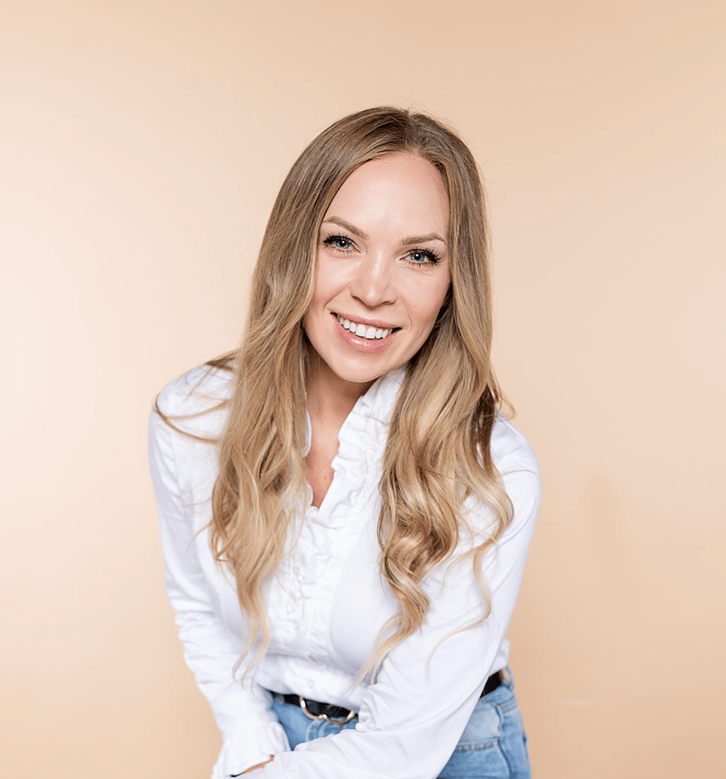 Professional portrait of Zoe Taylor, St. Louis Realtor and founder of Moving Medicine STL.