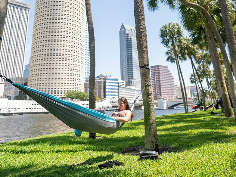 Relaxing along the Tampa waterfront with palm trees and downtown Tampa skyline views
