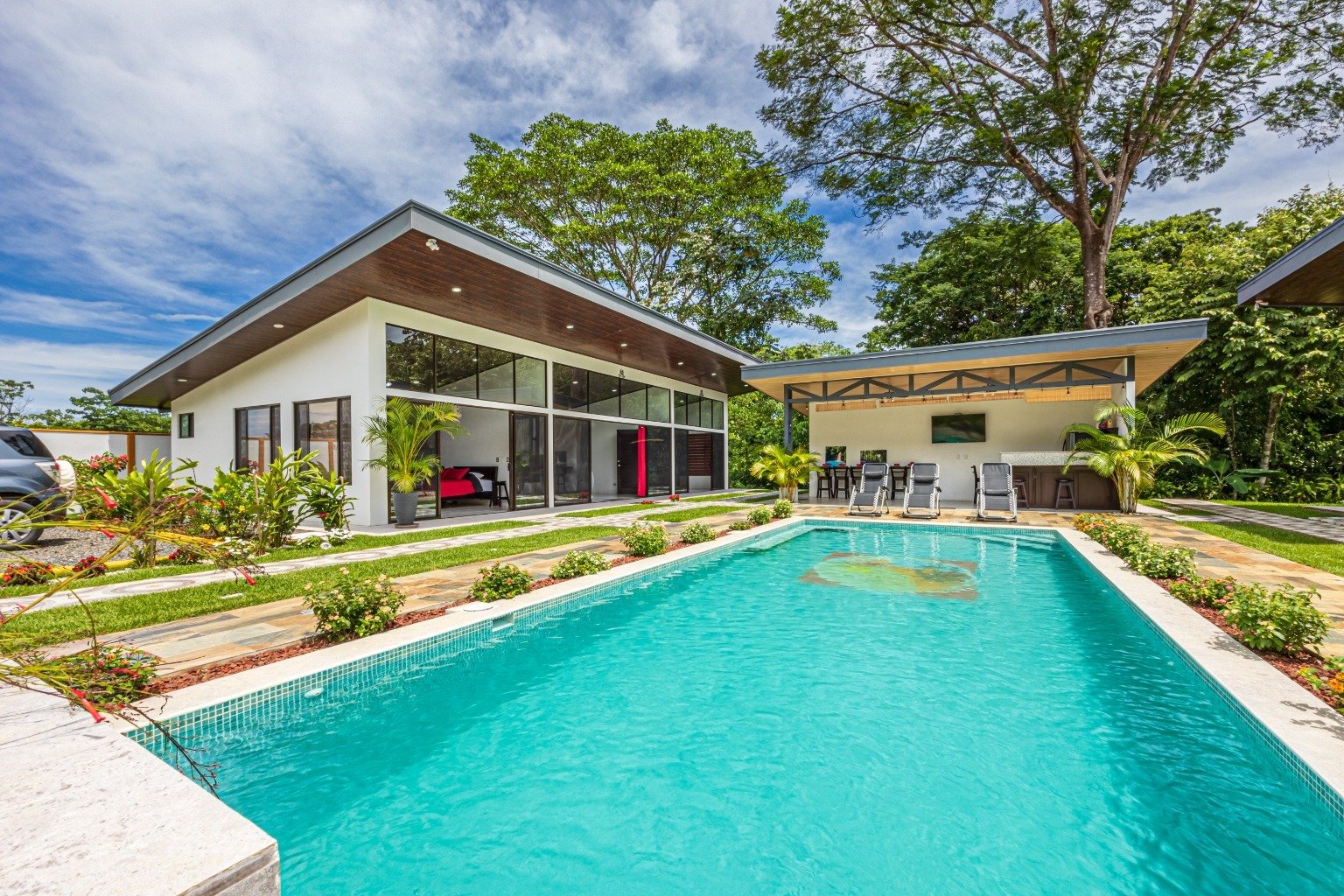 Incredible turnkey investment opportunity, 3 Rental villas, and a 2 Bedroom Home with a large pool.