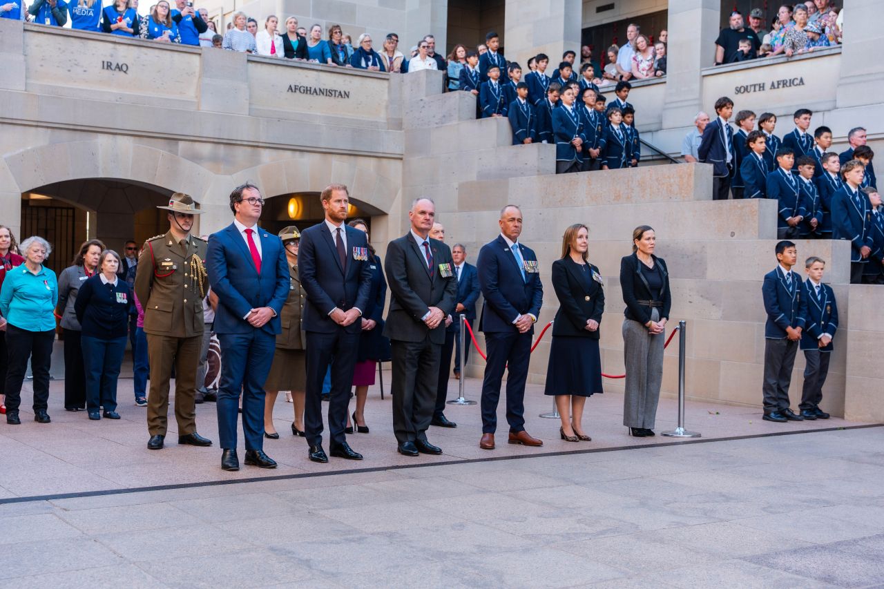 Brendan Brown and Prince Harry standing with officials during Invictus Australia announcement ceremony in Canberra