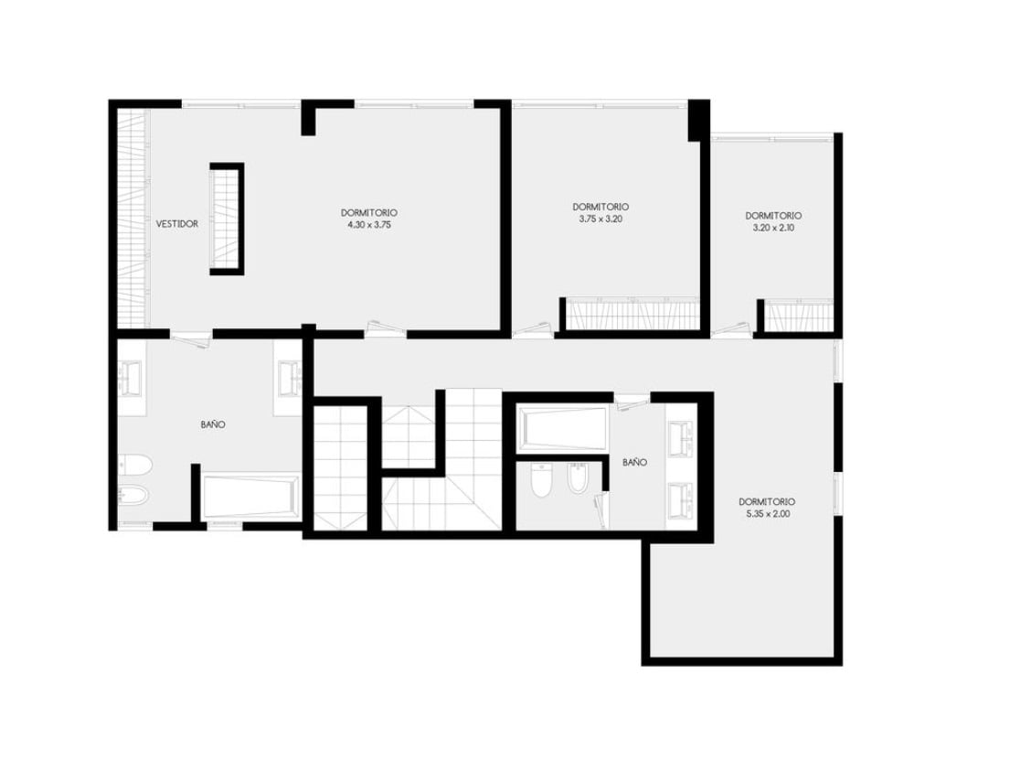 Floor plan with four bedrooms, two bathrooms, a dressing room, and a central stairway.