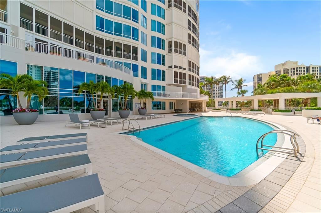 Luxury pool deck and high-rise condominium tower at Park Shore Naples Florida