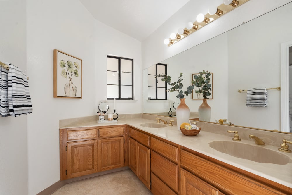 Primary suite bathroom with dual sinks in Petaluma home