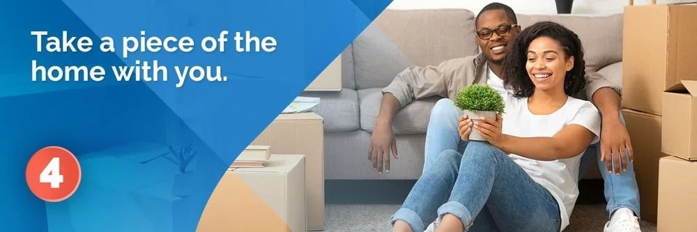 A couple holds a potted plant while sitting among moving boxes; the graphic says, “Take a piece of the home with you.”