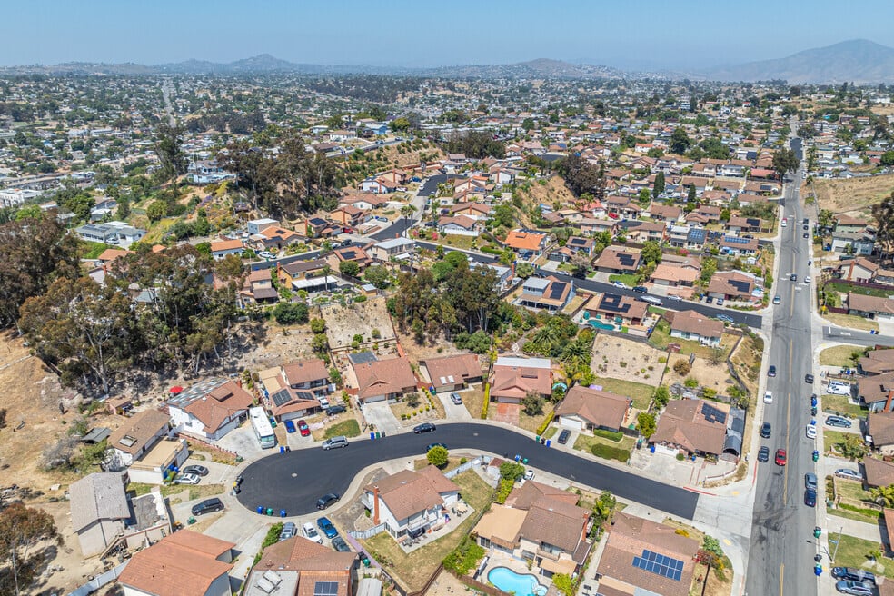 Aerial view of Encanto neighborhood in Southeast San Diego featuring single-family homes, cul-de-sacs, and hillside terrain—highlighting real estate value and family-friendly living.
