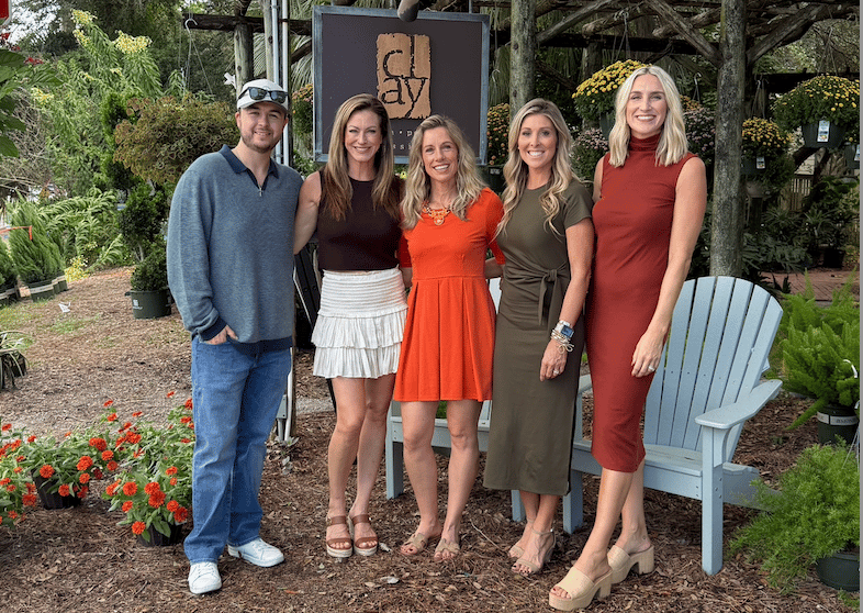 The Kendall Hood Collection team at Clay 30A garden center in Seagrove Beach, exploring plants, gifts, and outdoor furniture.