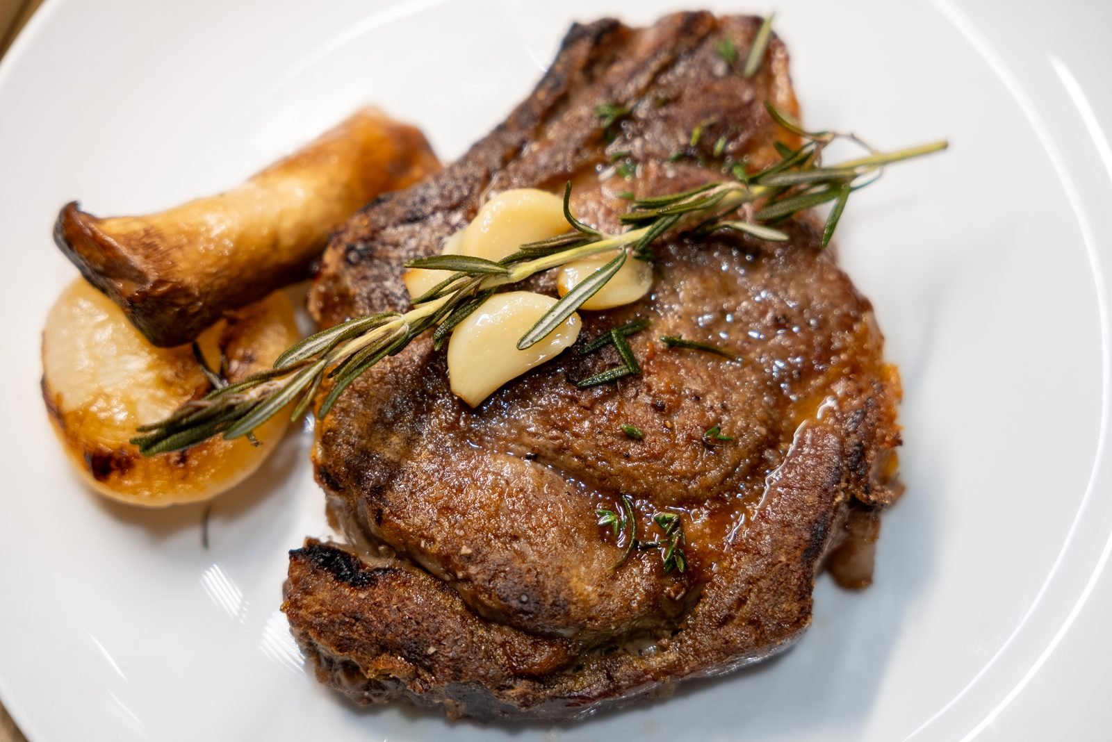 A tomahawk steak plated at Selanne Steak Tavern in Laguna Beach.