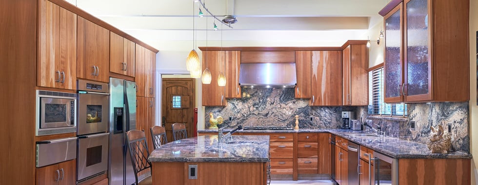 Grand is the best word to describe this architecturally stunning Spanish style home