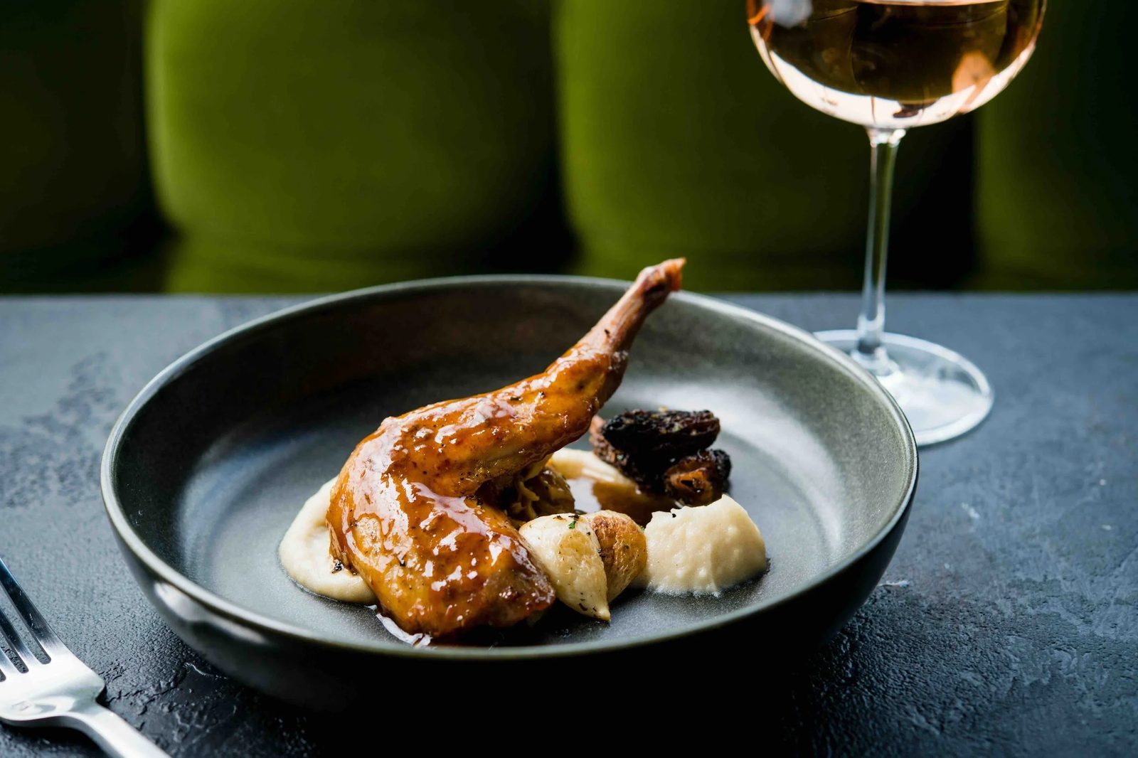 A duck confit dish plated at Fable and Spirit.