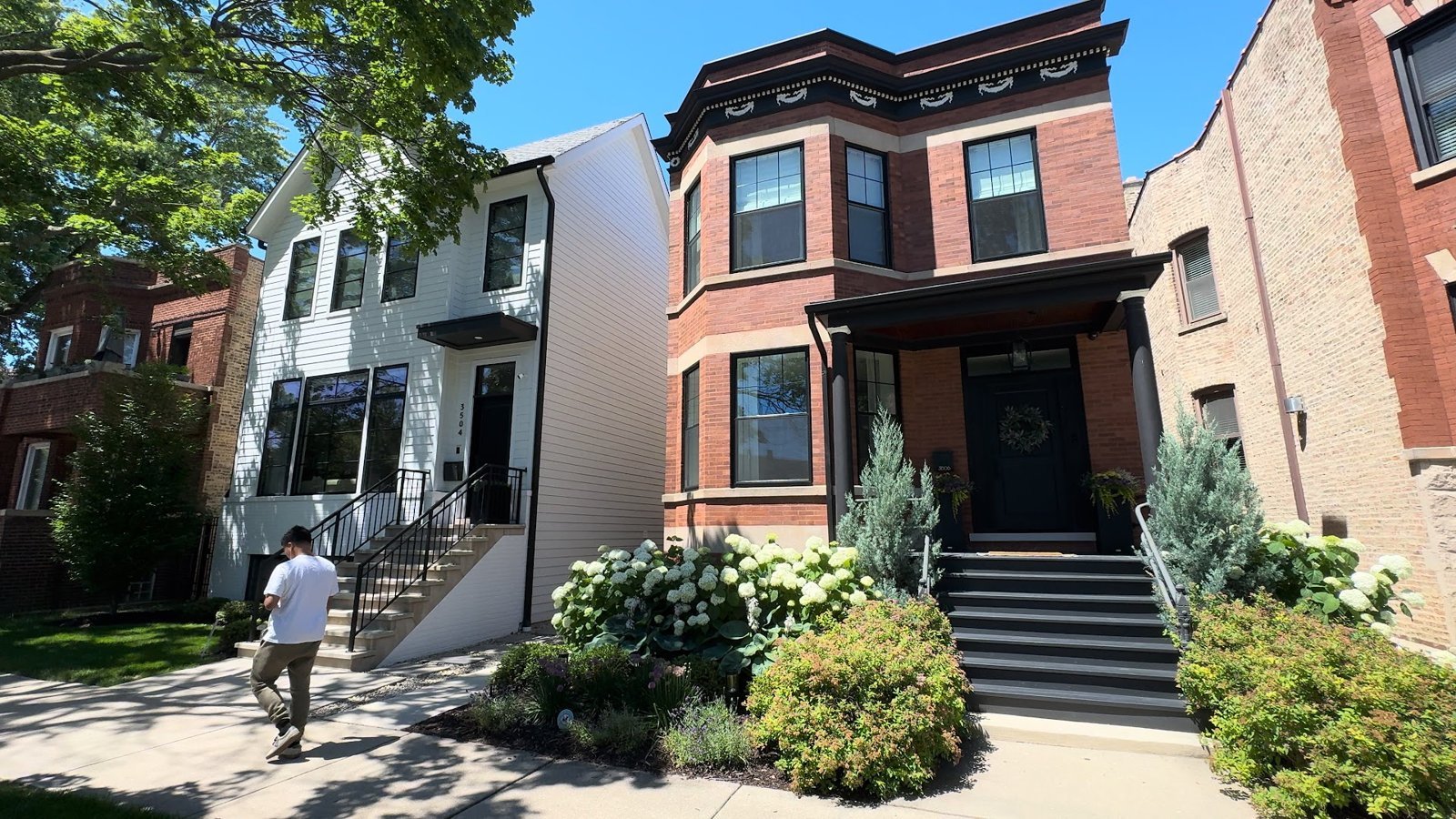 Brick two-flat next to a new construction home in North Center, Chicago