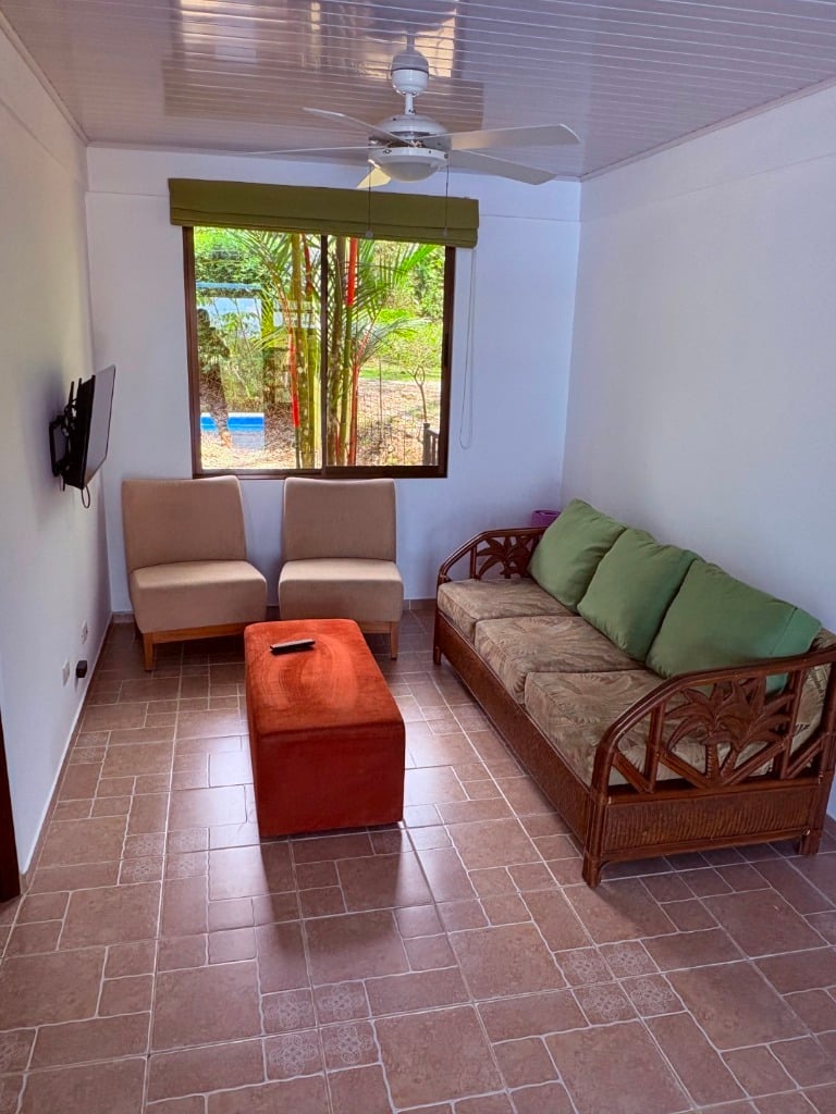 Move in ready 2 bedroom / 2 bathroom home with window ocean view and pool in Ojochal.