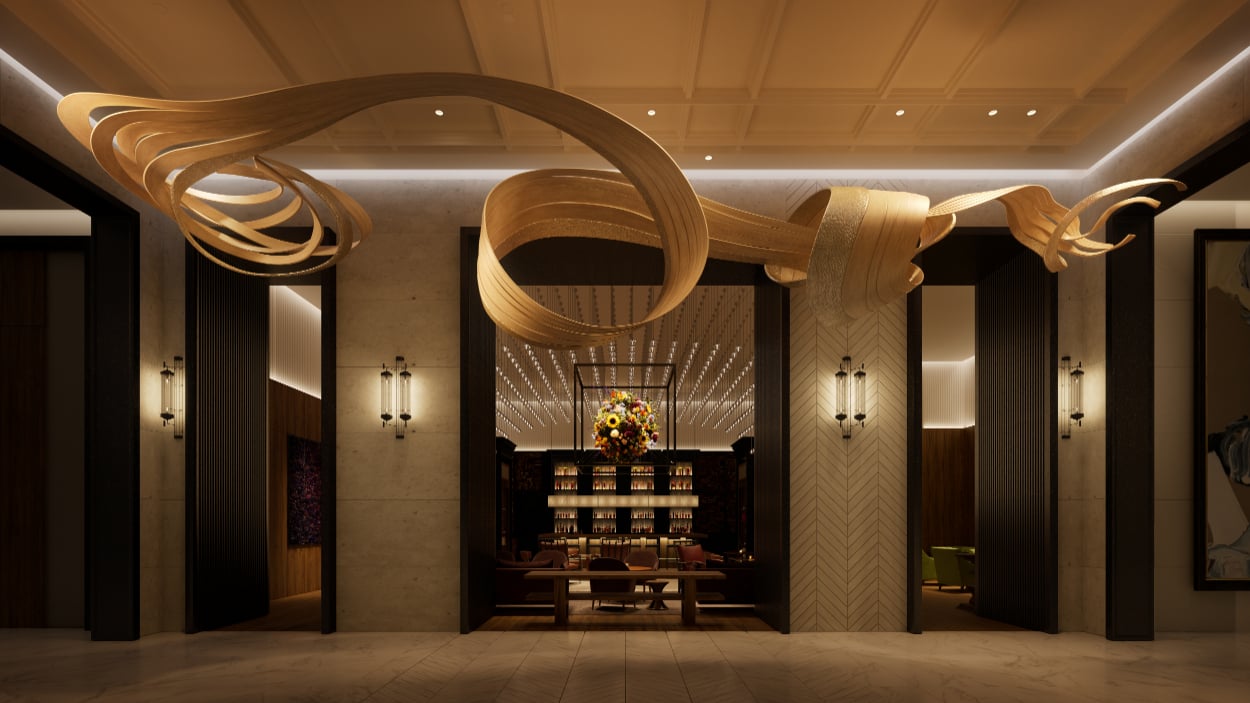 Luxury lobby with a sculptural golden chandelier and a lounge beyond the central doorway.