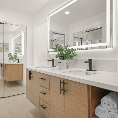 remodeled primary bathroom with custom cabinetry