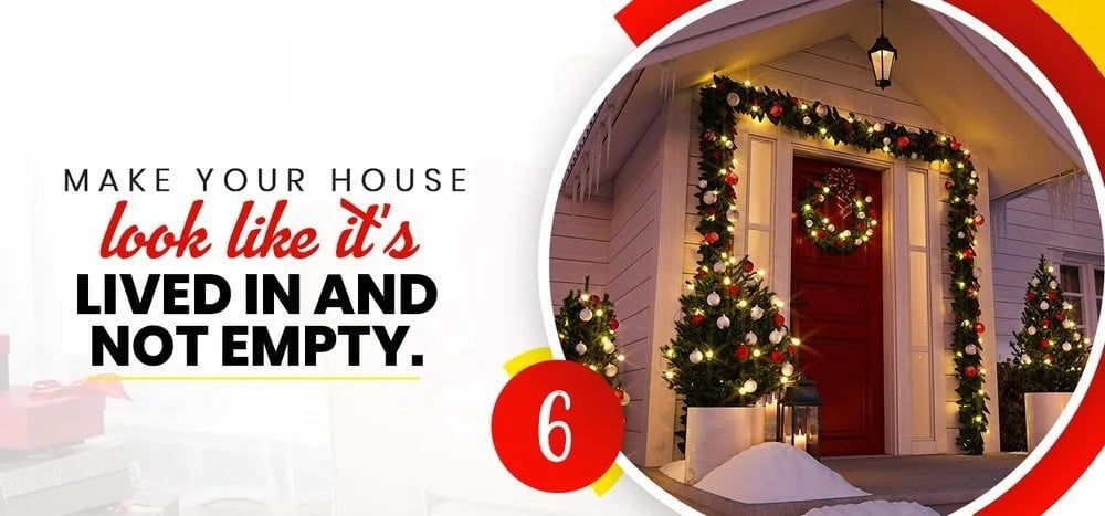 Tip 6: Make your house look lived in and not empty; a Christmas-lit entrance at night.