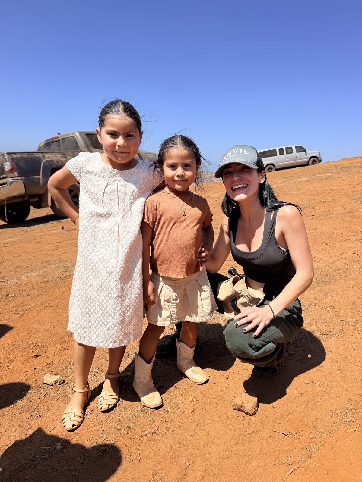 Jade Larney with three girls from the April Impact MVMT build, back on site at the September build in Baja