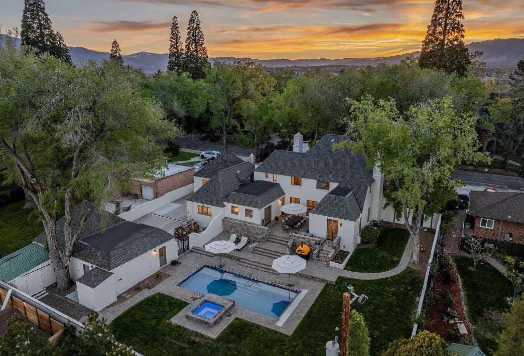 This home sits proudly along tree-lined Marsh Avenue 89509 and retains many original details, including hardwood flooring, pocket doors, and two fireplaces. The spacious main level features a formal living room, elegant dining room, parlor (counted as a bedroom), and a cozy family room, all thoughtfully connected for everyday living and entertaining.