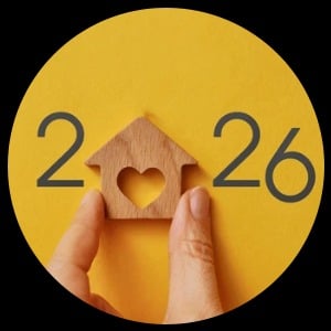 2026 formed by digits around a wooden house with a heart-shaped opening