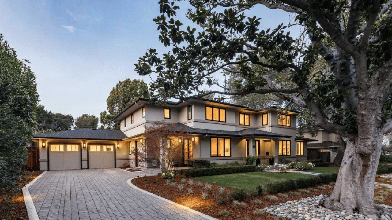 Luxury home in Atherton with long driveway and landscaped grounds, showcasing the exclusivity of Silicon Valley neighborhoods.