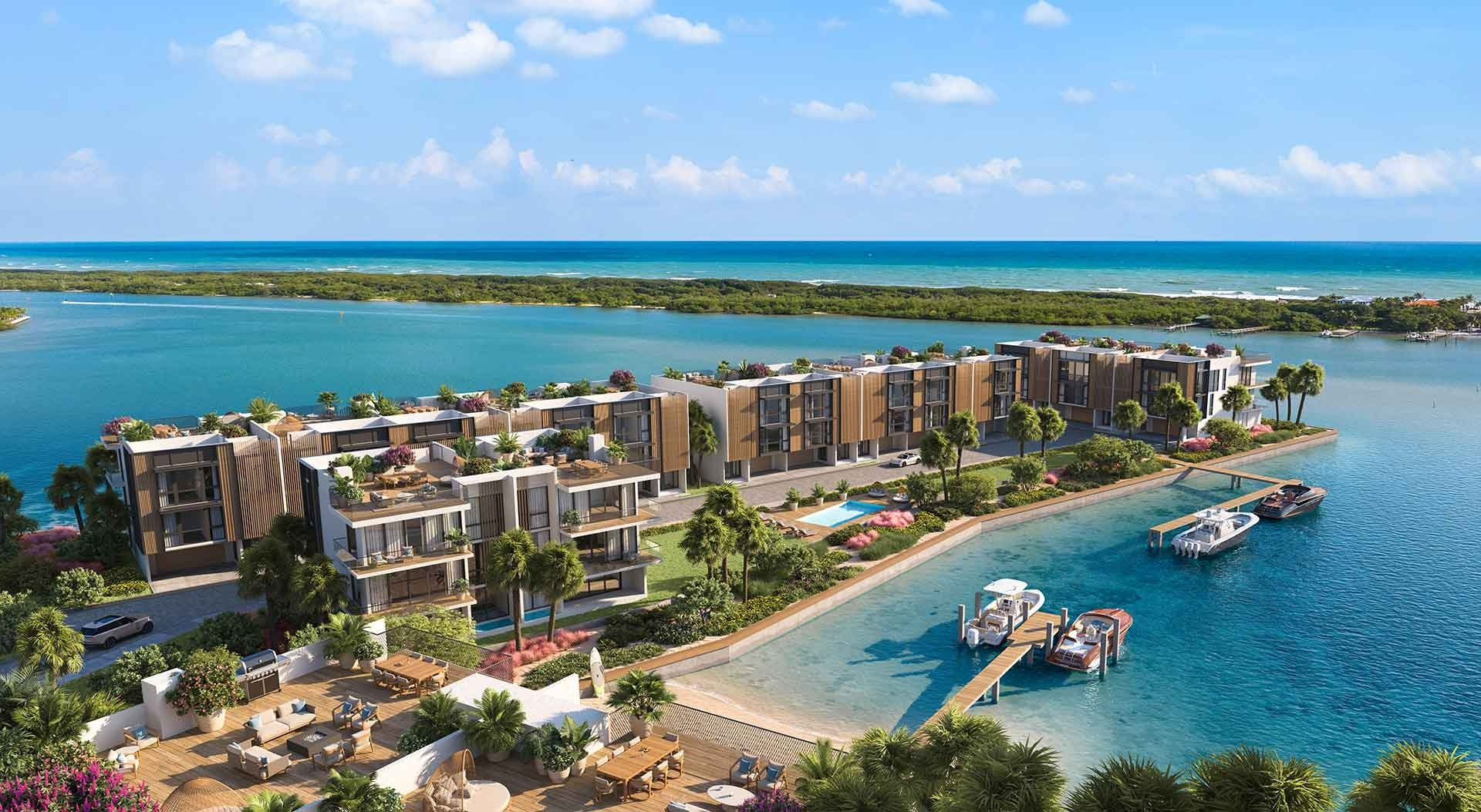 Aerial rendering of waterfront residences with landscaped terraces, a pool, and private boat docks.