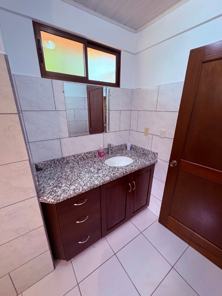 Move in ready 2 bedroom / 2 bathroom home with window ocean view and pool in Ojochal.