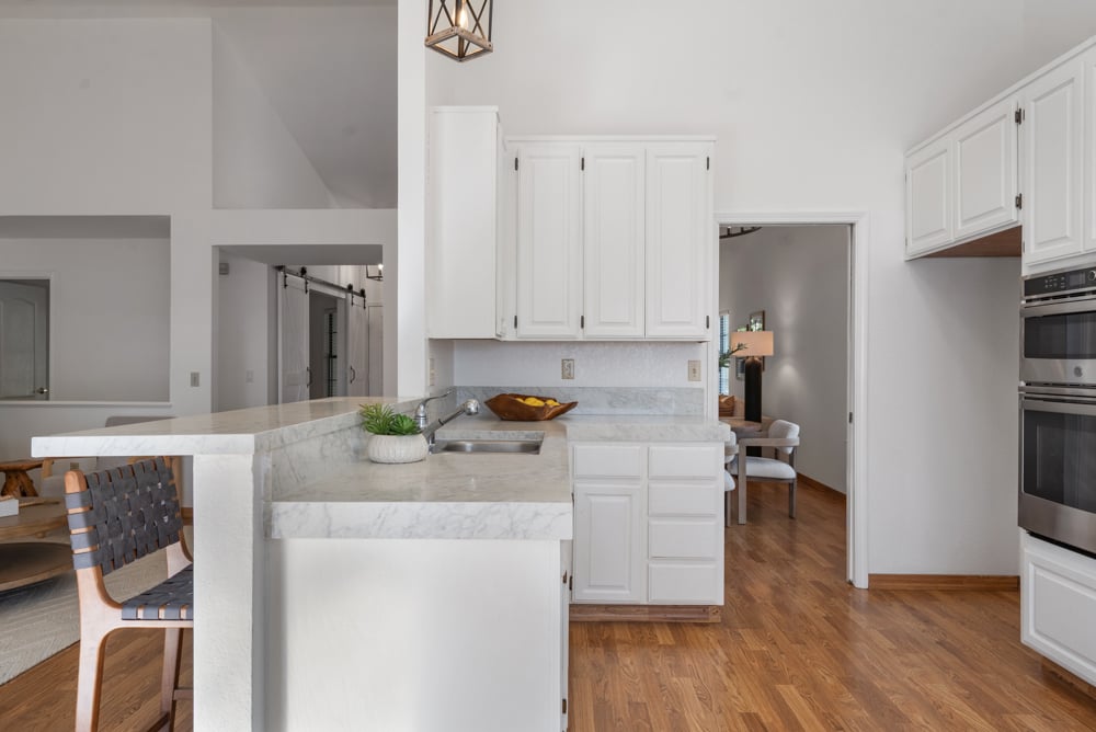 Galley-style kitchen with breakfast bar and ample counter space in Petaluma home