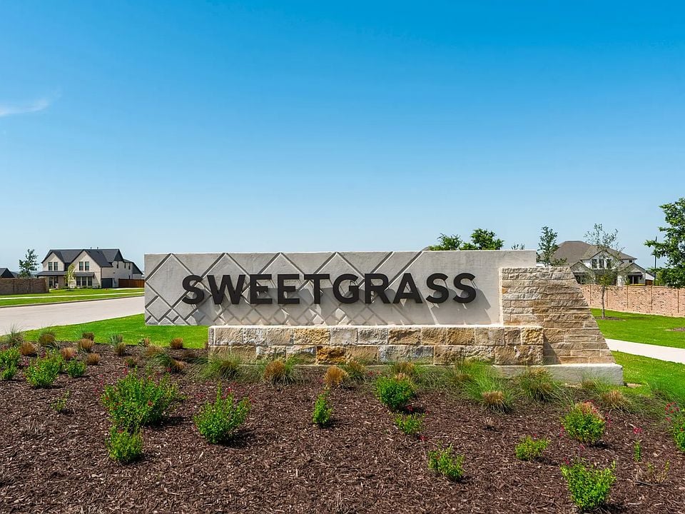 White and brown Sweetgrass sign with green shrubs in Haslet Texas by Carter Signature Properties