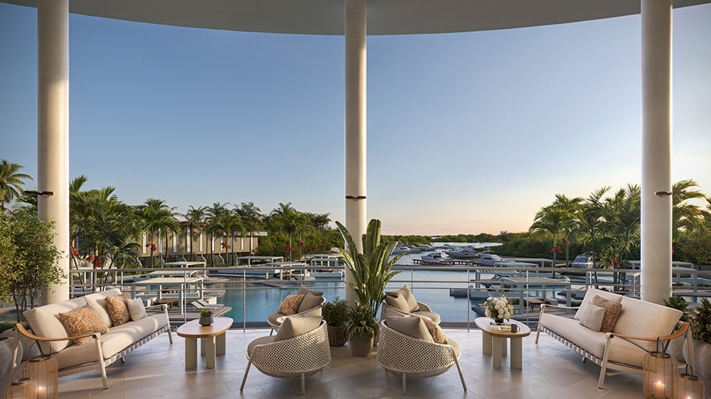 Rendering of an open-air lounge overlooking the water and boats at The Ritz-Carlton Residences, Estero Bay