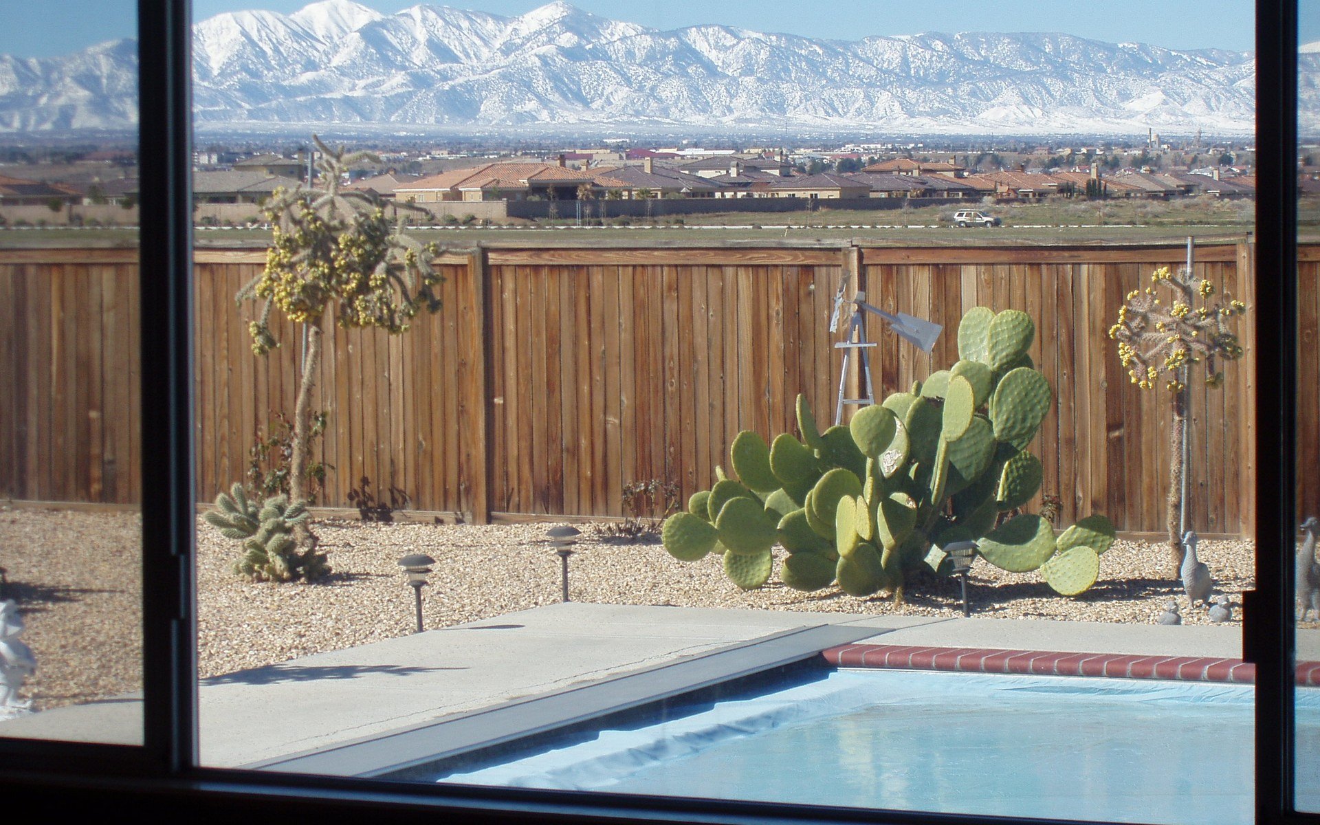 Backyard pool and desert landscaping with a mountain view at an Apple Valley home, photographed in 2014