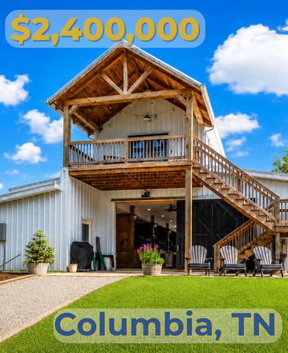Two-story home with a covered wooden balcony, exterior staircase, and patio in Columbia, Tennessee.