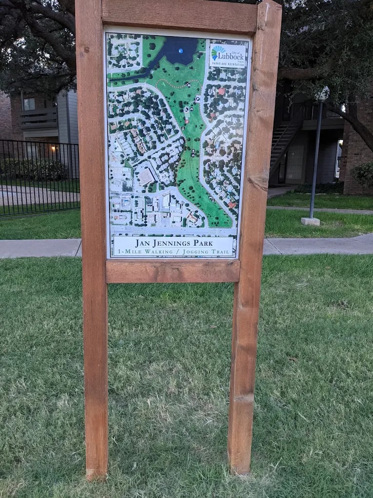 Jan Jennings Park map sign showing the one-mile walking and jogging trail.