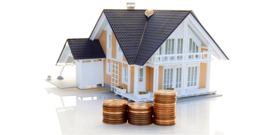 Miniature house behind three stacks of coins of increasing height.