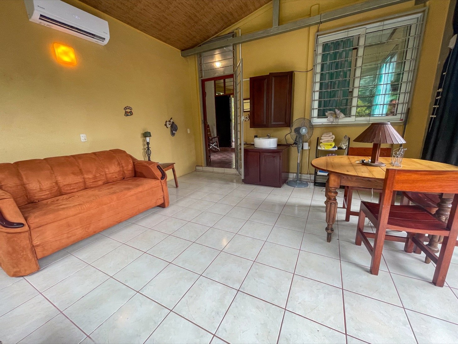 Cozy Colonial Home with Lush Gardens and Prime Commercial Prospects