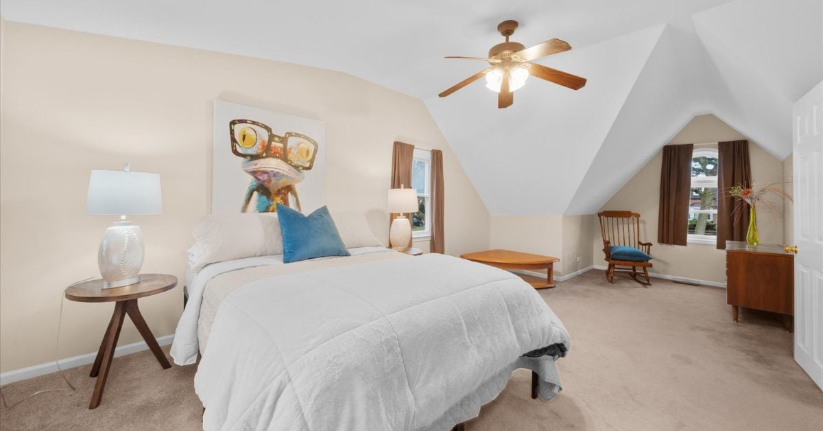 Spacious bedroom with vaulted ceiling and ceiling fan at 4217 Elm St Downers Grove IL 60515 listed by the Tully Team