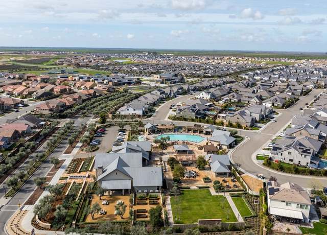 Aerial view of new housing subdivisions and community amenities in Madera California