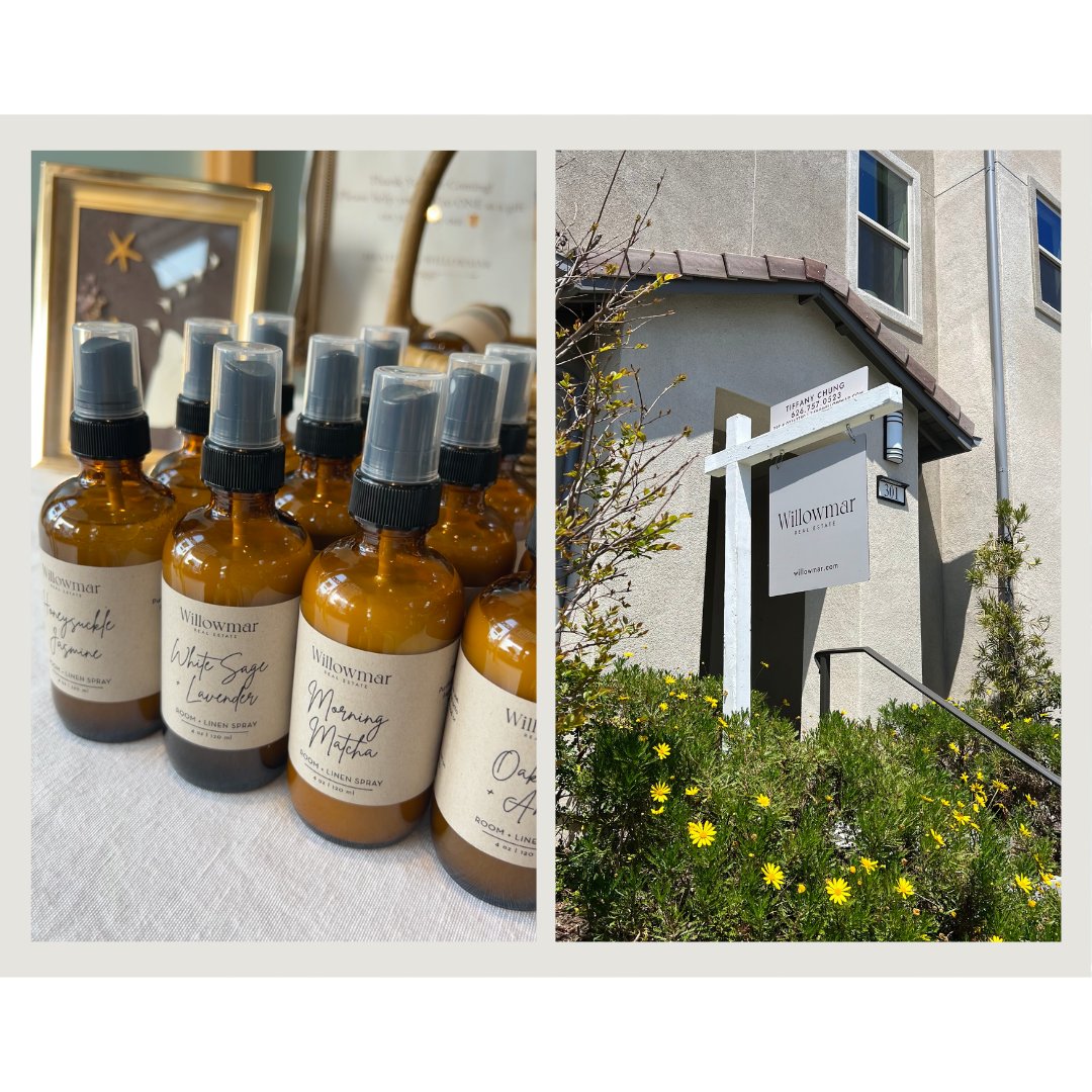 Willowmar Real Estate bottles of room spray beside its building entrance framed by yellow flowers.