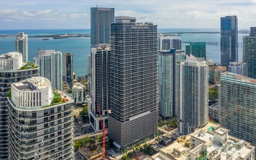 Downtown Miami skyline beside Biscayne Bay, viewed from above.