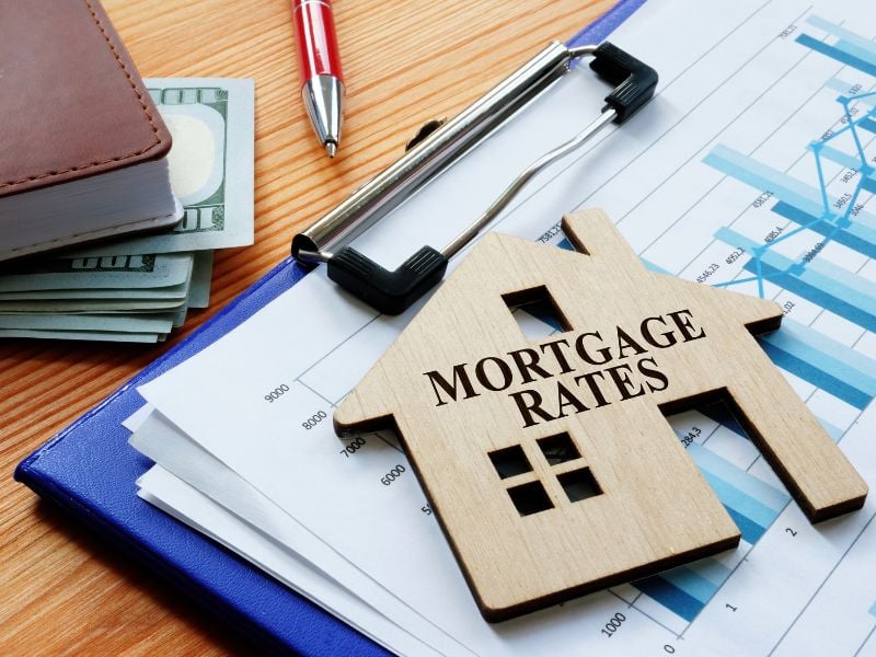 wooden house with words on it to visualize topicWill mortgage rate interest go down?