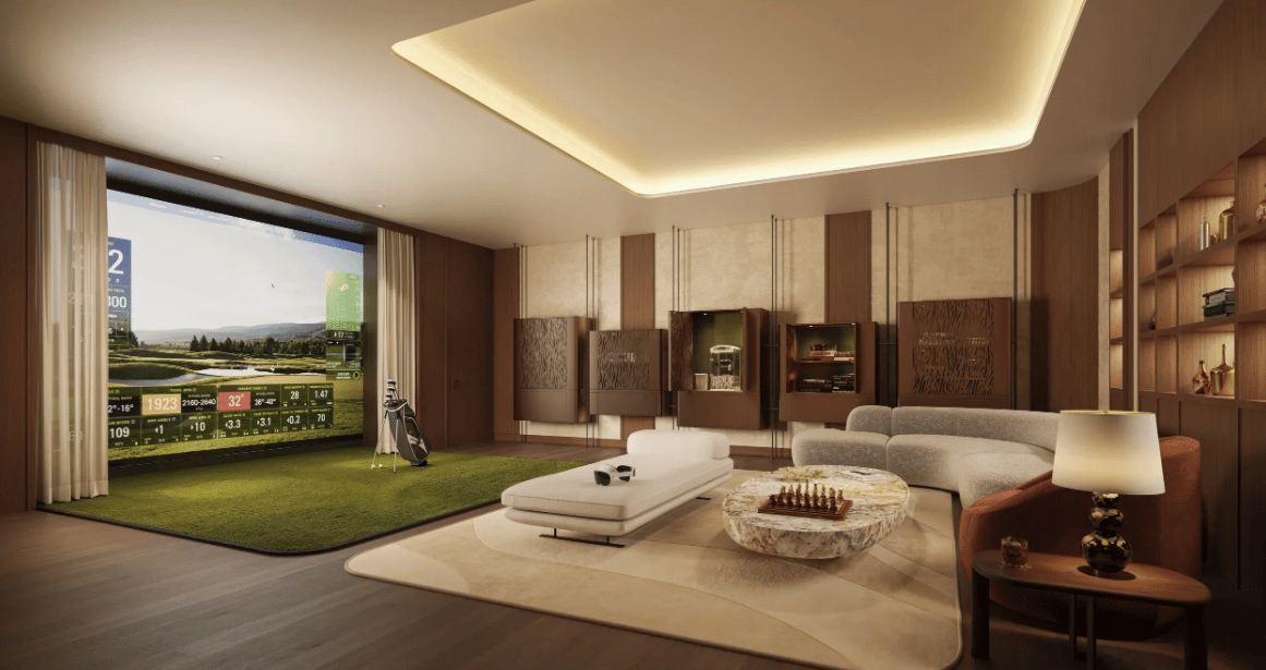 Luxury lounge with a golf simulator, putting turf, built-in cabinets, and a curved sofa.