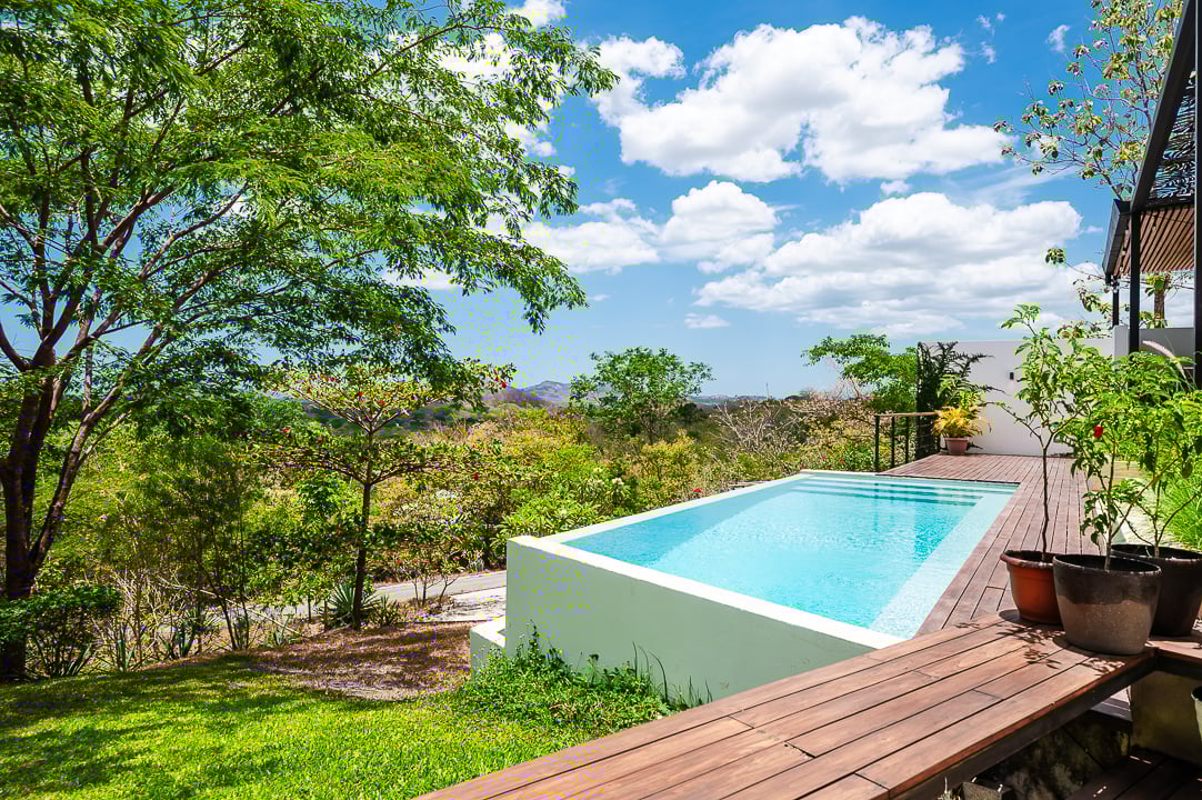 Casa Kalachuchi | Gorgeous Modern Jungle Oasis with Sunset Views in Gated Community